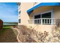 Condo exterior showcasing water view and private balcony at 2424 Placida Rd # C101, Englewood, FL 34224