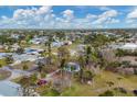 Aerial view of residential neighborhood with vacant lots at 321 S Mango St, Englewood, FL 34223