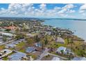Wide aerial view of residential area near the water at 321 S Mango St, Englewood, FL 34223