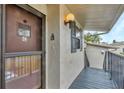 Exterior view of condo building with stairs and entrance at 4260 Placida Rd # 18C, Englewood, FL 34224