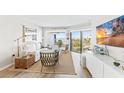 Living room with ocean views, comfy seating, and large TV at 5000 Gasparilla Rd # Dc307, Boca Grande, FL 33921