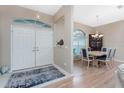 Entryway with double doors and view into dining area with light wood table at 60 White Marsh Ln, Rotonda West, FL 33947