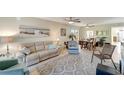 Open concept living and dining area with neutral tones at 6699 San Casa Dr # S1, Englewood, FL 34224