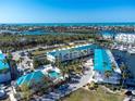 Waterfront property with boat slips and community pool in a tropical setting at 8226 Harborside Cir, Englewood, FL 34224