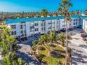 Modern condo complex with lush landscaping and private parking at 8226 Harborside Cir, Englewood, FL 34224
