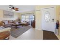 Bright living room with comfortable seating and coastal decor at 93 Rotonda Cir, Rotonda West, FL 33947