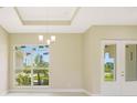 Bright dining room with large window and elegant chandelier at 14291 Ingraham Blvd, Port Charlotte, FL 33981