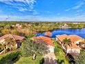 Community of homes near a lake, showcasing waterfront property at 14394 Silver Lakes Cir, Port Charlotte, FL 33953