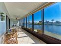 Relaxing screened patio overlooking the lake, perfect for outdoor dining at 1783 Lake Pl # 1783A, Venice, FL 34293