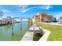 Private wooden dock extending into the waterway, offering convenient boat access at 1901 Illinois Ave, Englewood, FL 34224