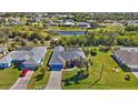 Bird's-eye view of home, showcasing the property and surrounding neighborhood at 62 Marker Rd, Rotonda West, FL 33947