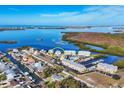 Bird's eye view showcasing waterfront property and surrounding community at 7180 Brittany Cir, Englewood, FL 34224