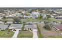 Aerial view of a beautiful home with a canal view and lush landscaping at 8 Broadmoor Ln, Rotonda West, FL 33947