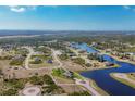 Aerial view of a single Gathering home with a private backyard, situated in a quiet residential community at 1 Calm Ct, Placida, FL 33946