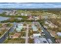 Aerial view of waterfront homes and community with golf course at 10451 Sherman St, Englewood, FL 34224