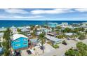 Beautiful beach neighborhood featuring a mix of colorful homes, palm trees, and ocean views at 1100 Gulf Blvd, Englewood, FL 34223