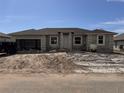 New construction home exterior, featuring a single-story design and a two-car garage at 14149 Whittier Ln, Port Charlotte, FL 33981