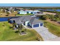 Waterfront home with a large backyard and two-car garage at 15410 Seafoam Cir, Port Charlotte, FL 33981