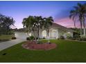 Single-story home with palm trees and well-manicured lawn at 2295 Chilcote Ter, Port Charlotte, FL 33981