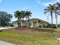 Single-story home with a two-car garage and a neatly landscaped yard at 2295 Chilcote Ter, Port Charlotte, FL 33981