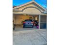 Two-car garage with storage and a car inside at 23111 Mineral Ave, Port Charlotte, FL 33954