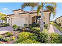 One-story home with a welcoming porch and nicely manicured landscaping at 24269 Spartina Dr, Venice, FL 34293