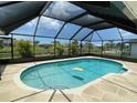 Relaxing screened in pool and patio area at 254 Mark Twain Ln, Rotonda West, FL 33947