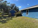 Spacious backyard with a shed and fenced area at 2933 Vizza Ln, North Port, FL 34286