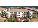 Condo building exterior showcasing Spanish-style architecture at 300 San Lino Cir # 322, Venice, FL 34292