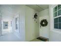 Condo hallway with white doors and light-colored walls at 300 San Lino Cir # 322, Venice, FL 34292