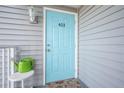 Light blue front door to condo unit at 4410 Warren Ave # 403, Port Charlotte, FL 33953