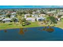 Birds-eye view of homes situated on a lakefront property at 8 Sportsman Rd, Rotonda West, FL 33947