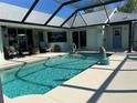 Inviting screened pool with patio furniture at 9458 Melody Circle, Port Charlotte, FL 33981