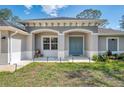 Two-story home with double doors and a welcoming porch at 1312 Wasilla St, North Port, FL 34291