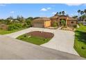 Single-Gathering home with a two-car garage and nicely landscaped yard at 15204 Aquarius Cir, Port Charlotte, FL 33981