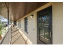 Hallway with multiple doors and windows, provides exterior access to individual condominium units at 4072 Oakview Dr # C8, Punta Gorda, FL 33980