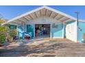 Large deck with view into the home's interior at 8888 Bay St, Placida, FL 33946