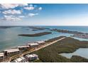 Aerial view of a condominium complex nestled among islands, boasting waterfront views at 1651 Beach Rd # 301, Englewood, FL 34223