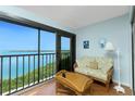 Cozy balcony with sliding glass door offering water views, perfect for relaxation at 1651 Beach Rd # 301, Englewood, FL 34223