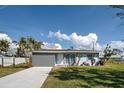 Charming single-story home boasting a new driveway and well-maintained landscaping that enhances its curb appeal at 5031 Lucine Rd, Venice, FL 34293