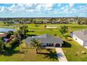 Aerial shot of the home near the golf course and waterway at 84 Caddy Rd, Rotonda West, FL 33947