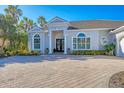 Charming home with a beautifully landscaped front yard and a welcoming entrance at 15 Boca Royale Blvd, Englewood, FL 34223