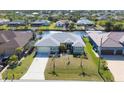 Aerial view of a waterfront home boasting a boat dock and beautiful canal access at 15610 Seafoam Cir, Port Charlotte, FL 33981