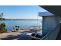 Water view from the second story balcony with swing on the beach at 5055 N Beach Rd # 203, Englewood, FL 34223