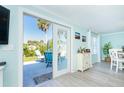 Bright dining area with sliding glass doors to the patio, offering seamless indoor-outdoor living at 8243 Pinetree Ln, Englewood, FL 34224
