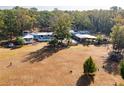 Property boasts a single-story ranch-style home with a pool, surrounded by mature trees at 9094 Preston Rd, Brooksville, FL 34601