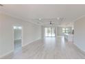 Bright and airy living room featuring elegant decor and seamless access to the pool area through sliding glass doors at 7282 Printer St, Port Charlotte, FL 33981