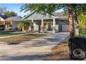 Nice gray house with a front porch and walkway at 1314 E Knollwood St, Tampa, FL 33604