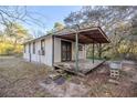 Rustic wooden deck extending from the back of the house at 11317 Salina St, Brooksville, FL 34614