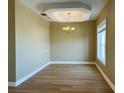 Bright dining room with hardwood floors and a chandelier at 13737 Victor Ave, Hudson, FL 34667